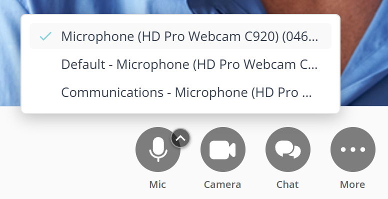 A list of microphones open above the call controls. The first entry has a tick beside it, and all three name the same hardware in different ways. Below the list the controls row shows Mic with a small upward arrow on its edge, then Camera, Chat and More.