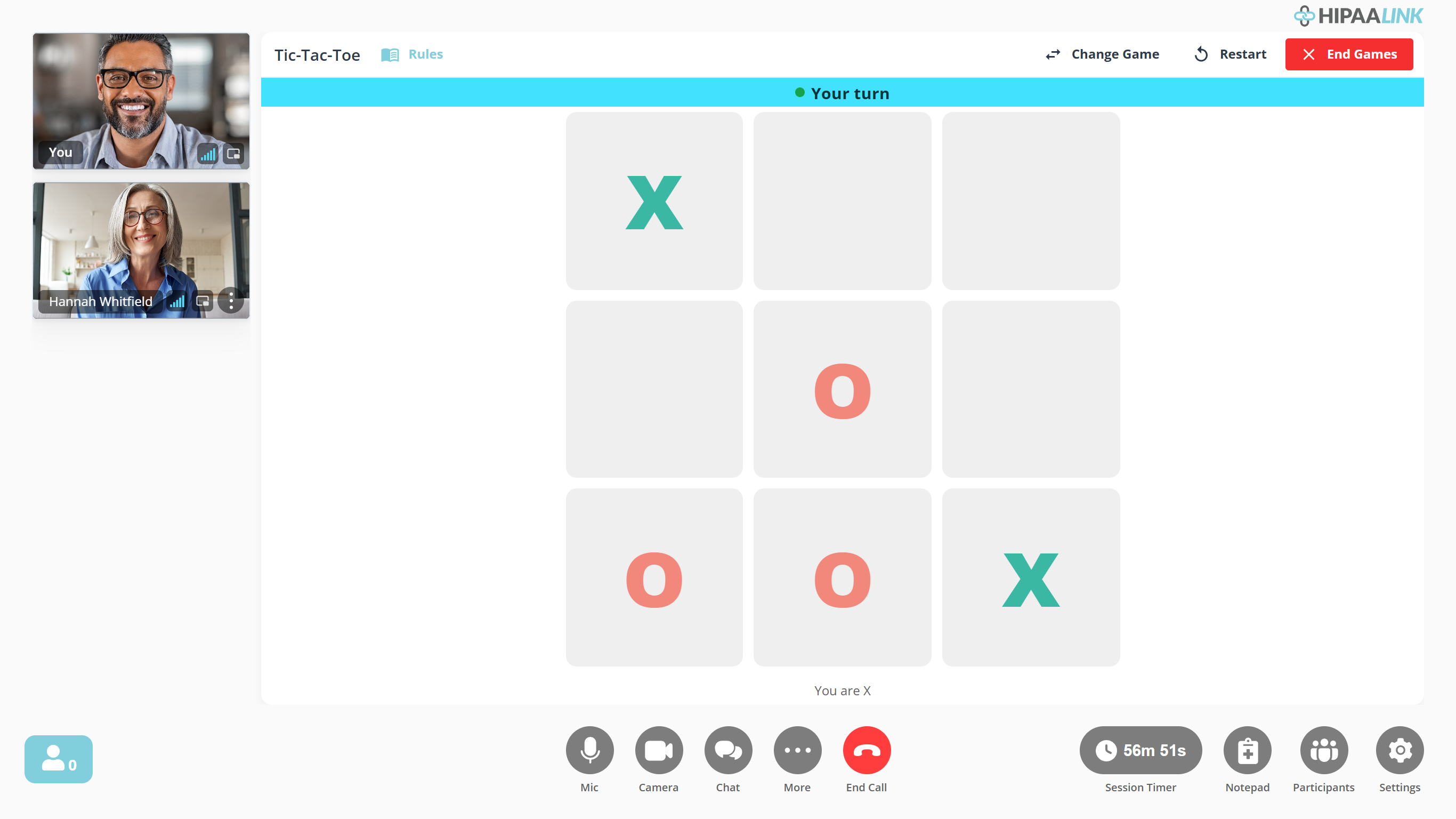 A call with a game of Tic-Tac-Toe part way through. The board fills most of the screen, headed Tic-Tac-Toe with a Rules link, and Change Game, Restart and a red End Games along the top right. A bright banner across the board reads Your turn, and a line under the board reads You are X. The two people in the call are stacked in a narrow column down the left.