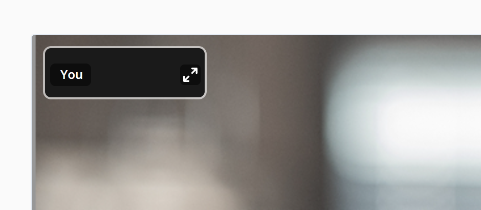 The same corner with the small picture gone. In its place is a slim black bar reading You, with a button of two outward arrows at its right end. The client video now fills the whole area.