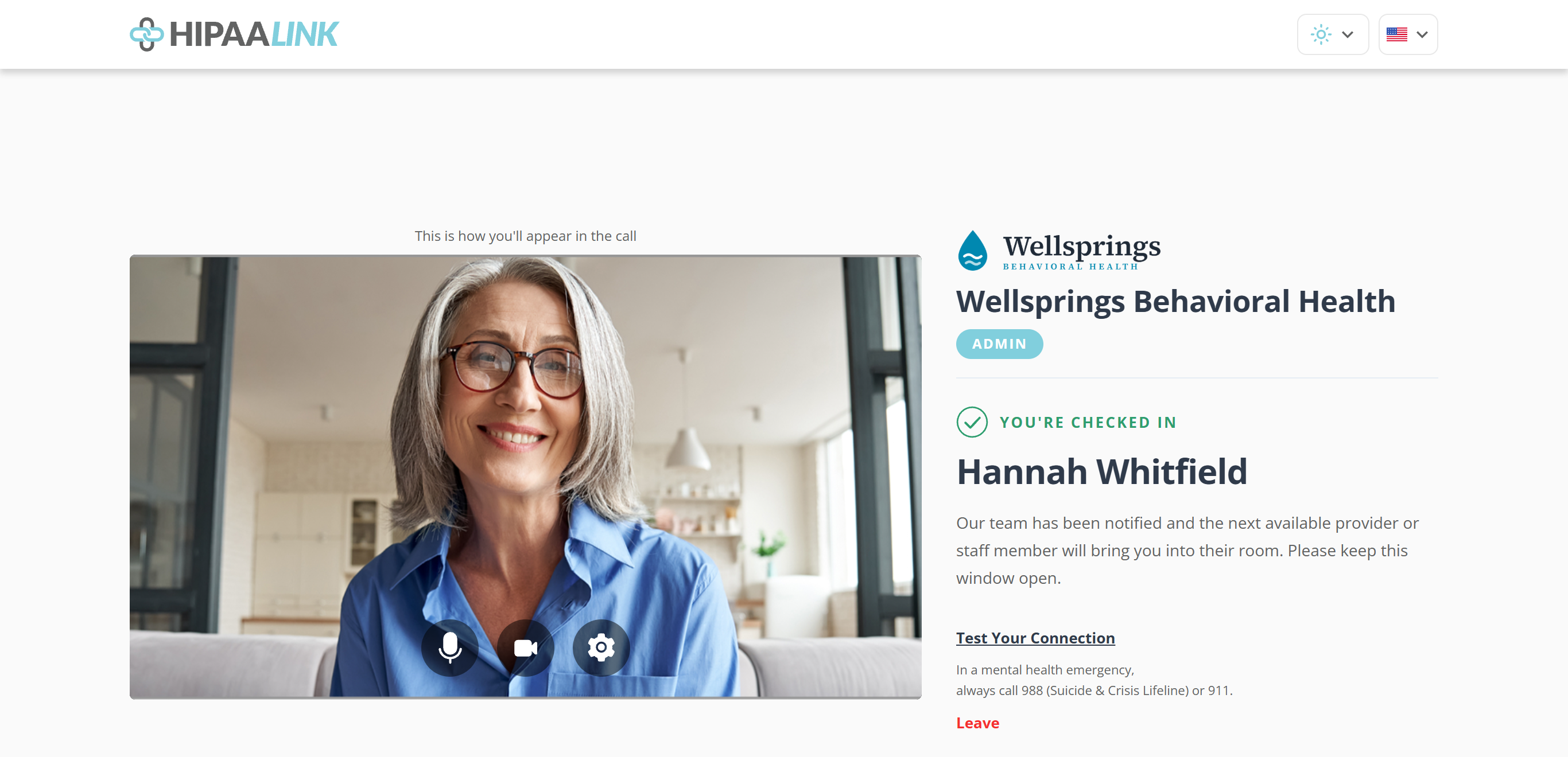The same page after checking in. The camera preview is unchanged on the left. On the right, under the clinic name and room tag, a green tick beside the words YOU ARE CHECKED IN, then the client name in large type, then a message saying the team has been notified and to keep the window open. Test Your Connection, the crisis line and a red Leave link follow.